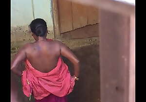 Desi shire sex-mad bhabhi nude bath show caught by hidden cam