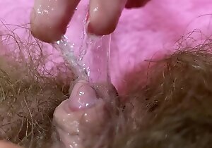 Huge pulsating clitoris orgasm in extreme close up regarding squirting hairy pussy grool play