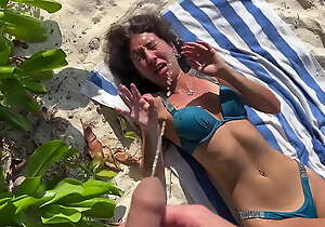 Pissed on girl on a develop b publish beach - She was stunned